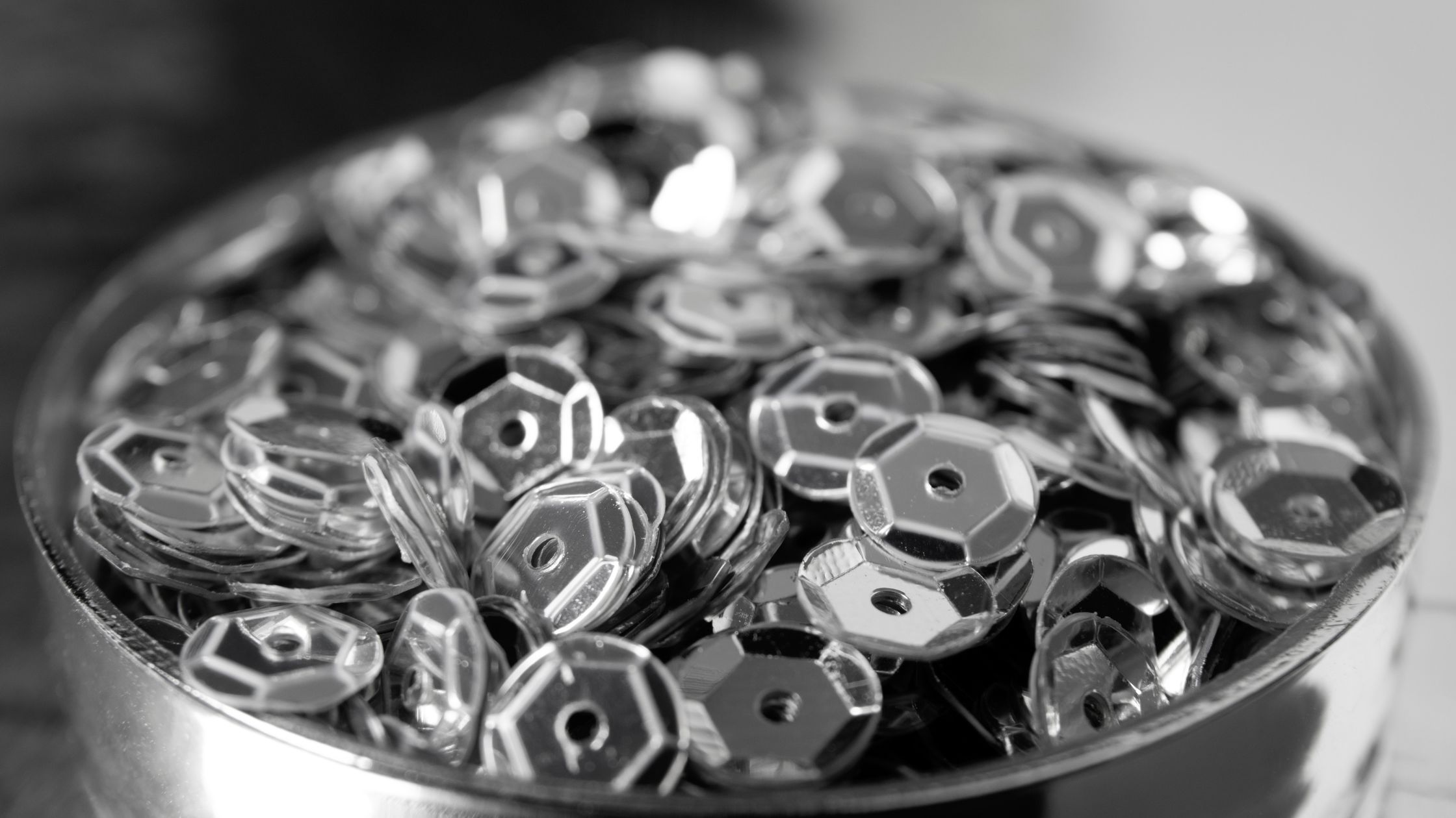 : Precision thread gauges and socket head cap screws arranged on a QC inspection bench