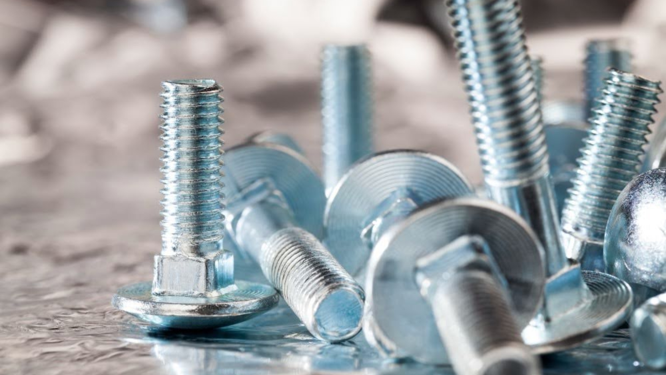 Blind rivet nuts and installation tool displayed on a fabrication workbench in Singapore