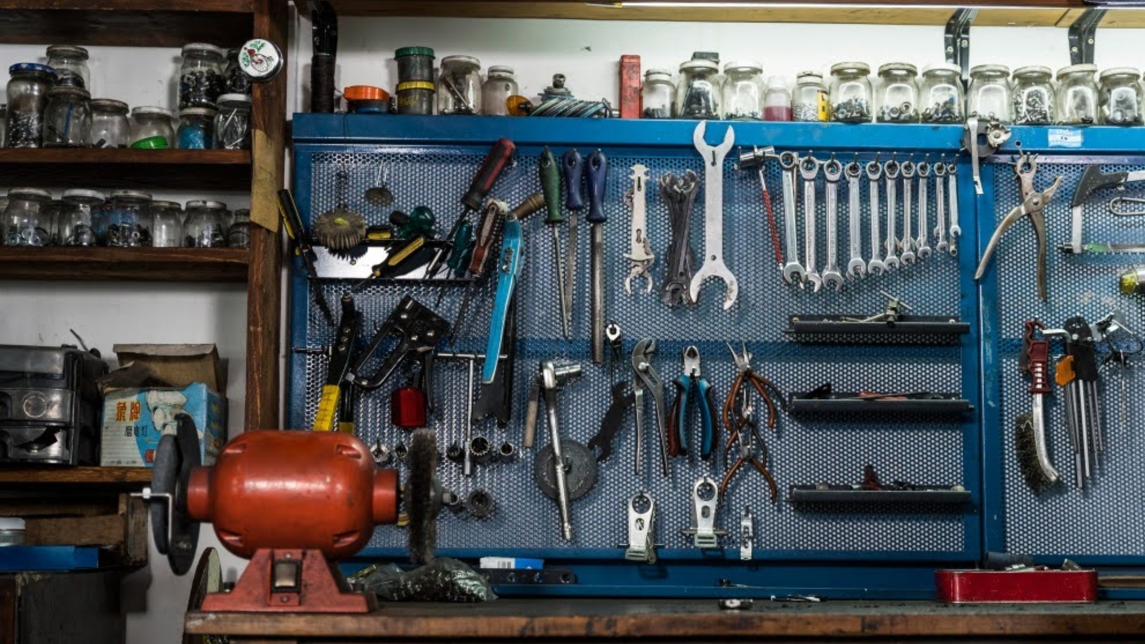 HeliCoil insert sizes and thread repair kit components displayed on a workshop bench in Singapore