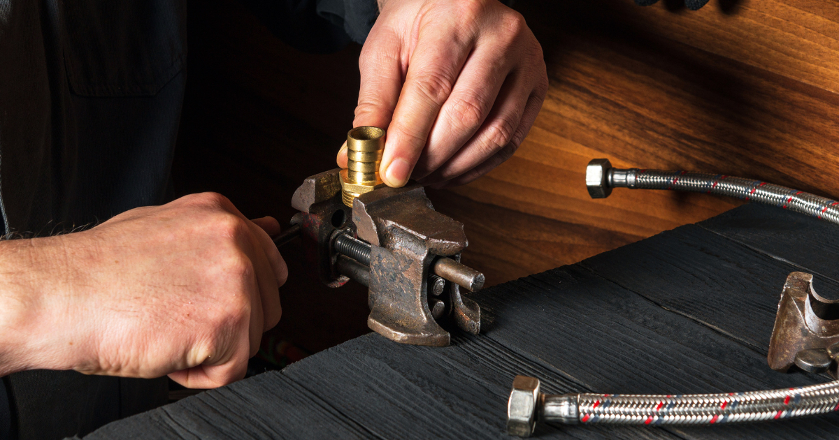 Technician using a HeliCoil thread repair kit to install an insert into an aluminium part